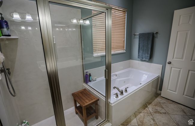 Bathroom featuring a shower stall and a whirlpool tub | Image 26