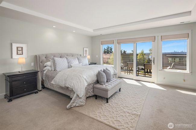 The primary suite is a private retreat, featuring the home’s best views from its deck, a spa-inspired bath and a boutique-sized closet with dedicated laundry. | Image 20