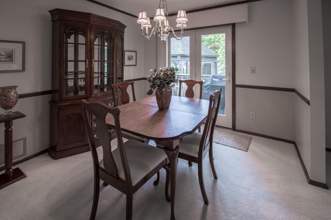 Dining room walks out to a large deck and screened gazebo | Image 6