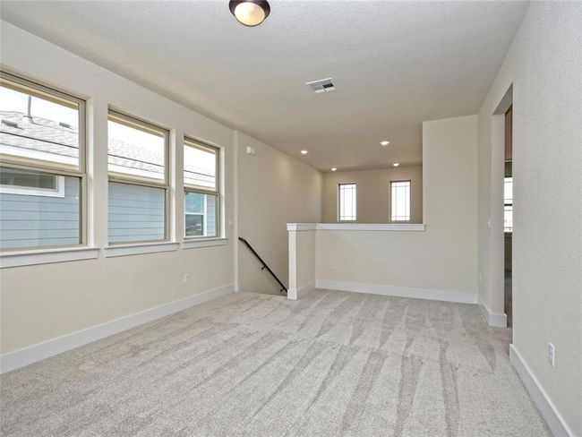 Spare room with light carpet and recessed lighting | Image 11