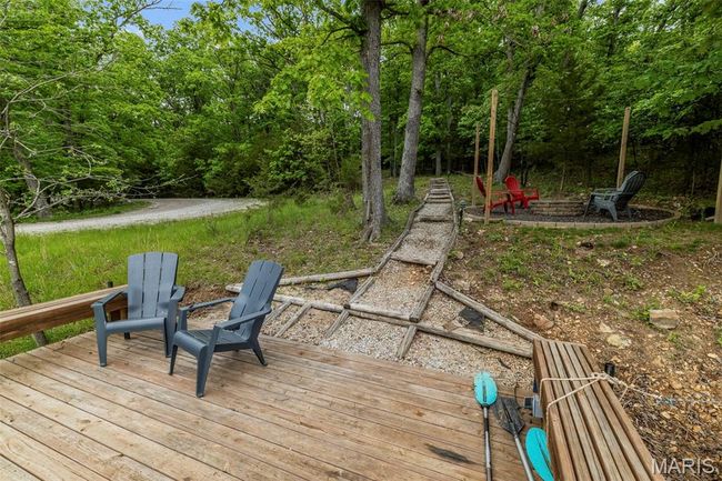 Deck featuring a fire pit | Image 55