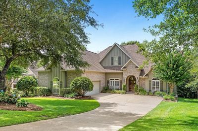 View of front of house with a garage and a front yard | Image 1