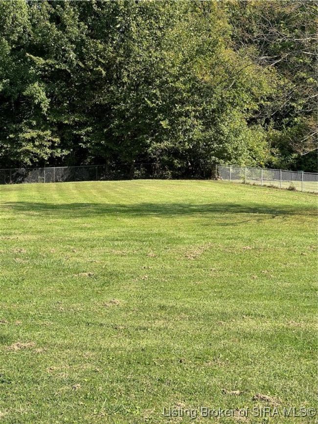 Large back yard is fenced and has plenty of room for a garden | Image 4