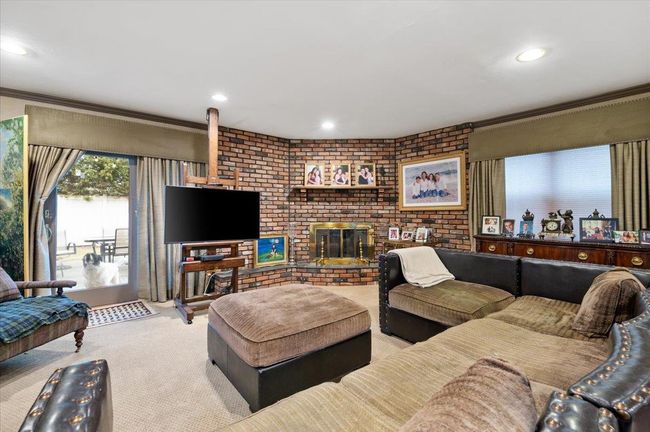 Living area with carpet floors, recessed lighting, and crown molding | Image 24