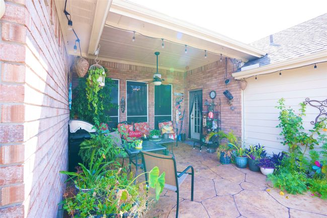 View of patio / terrace with ceiling fan | Image 25