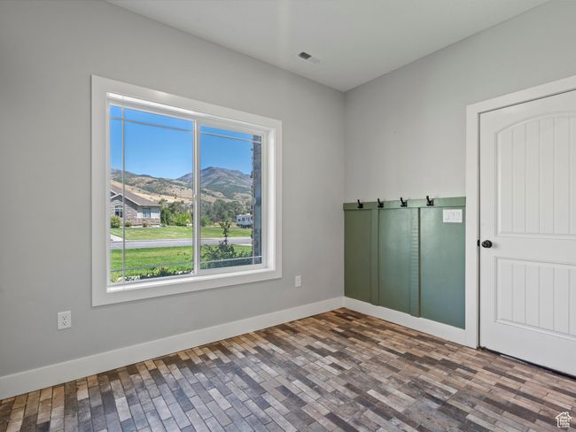 Unfurnished room featuring a mountain view and baseboards | Image 19