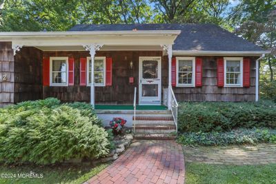 Front porch welcome's you to this home. This is not your average cape style home | Image 3