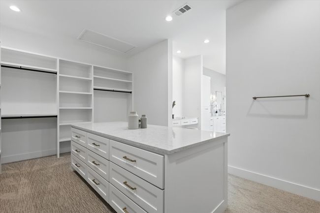Spacious closet with carpet flooring, visible vents, and attic access | Image 23