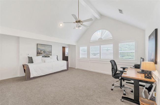 Large game room upstairs with an impressive vaulted ceiling and tons of natural light. | Image 22