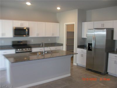 Kitchen with granite and stainless appliances | Image 3