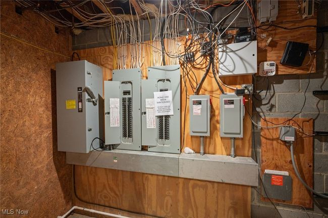 Utility room featuring electric panel | Image 42