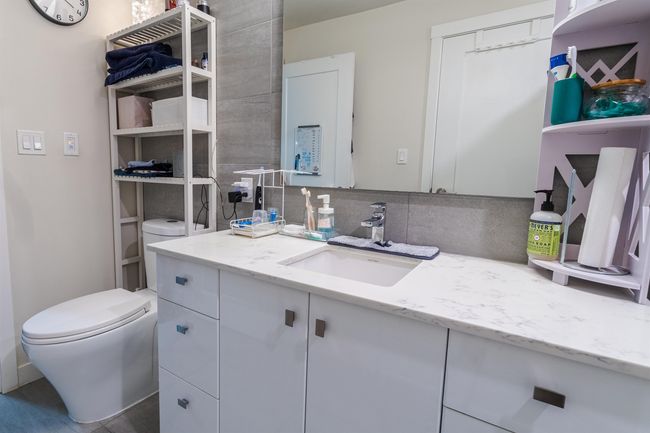 Bathroom featuring toilet and vanity | Image 15