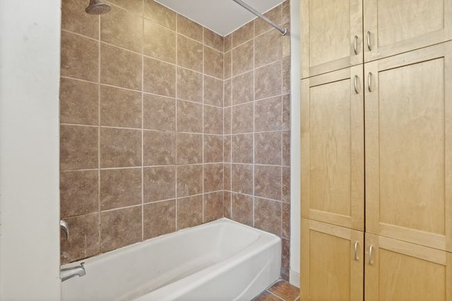 Full bathroom featuring shower / bathtub combination | Image 17