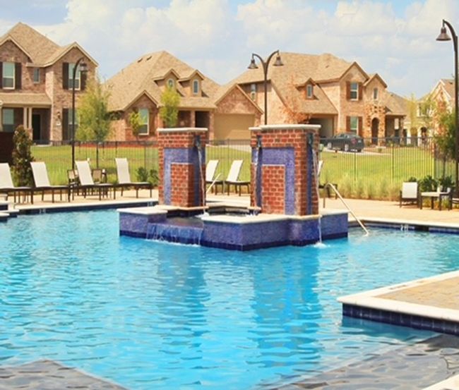 Community pool with fence, a patio, a hot tub, and a residential view | Image 35