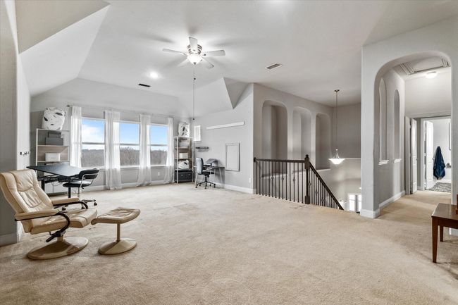 Living area with ceiling fan, light carpet, and vaulted ceiling | Image 29