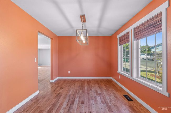 Spare room with wood finished floors and baseboards | Image 14