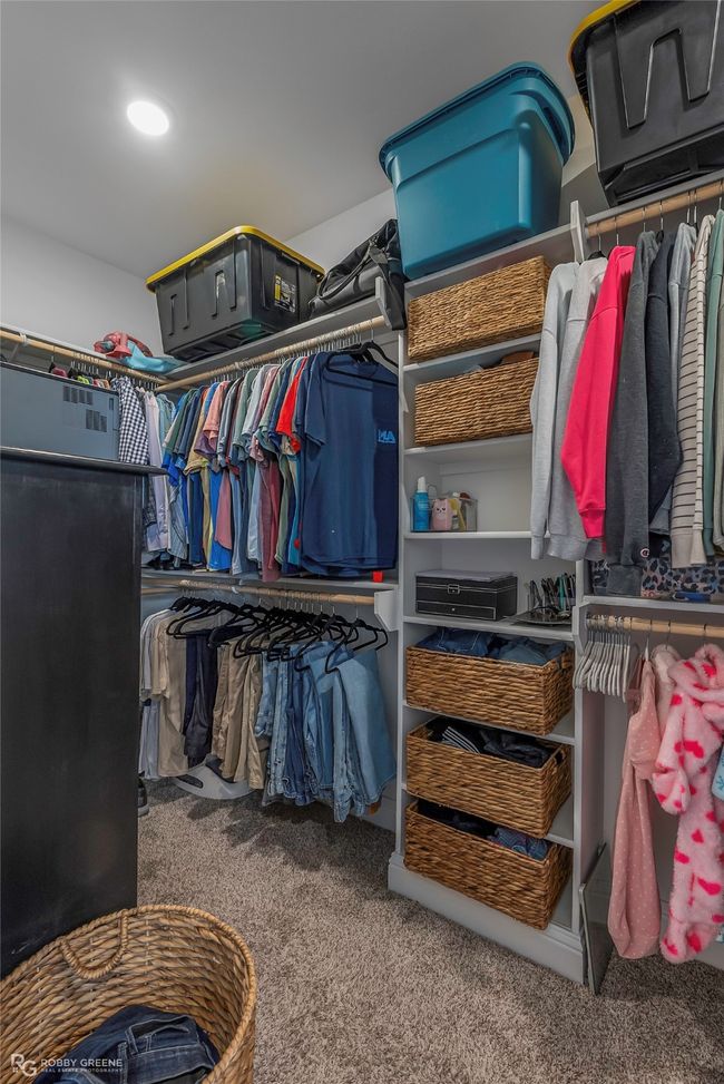 Walk in closet featuring carpet | Image 19