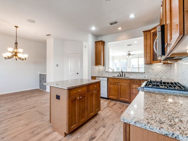 Kitchen is open to Dining | Image 9