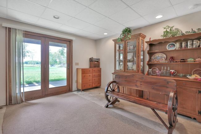 Lower level family room walks out to the back yard under the deck. | Image 23