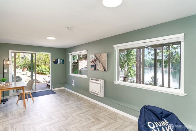 Other end of bonus room with slider to the hot tub and backyard | Image 33