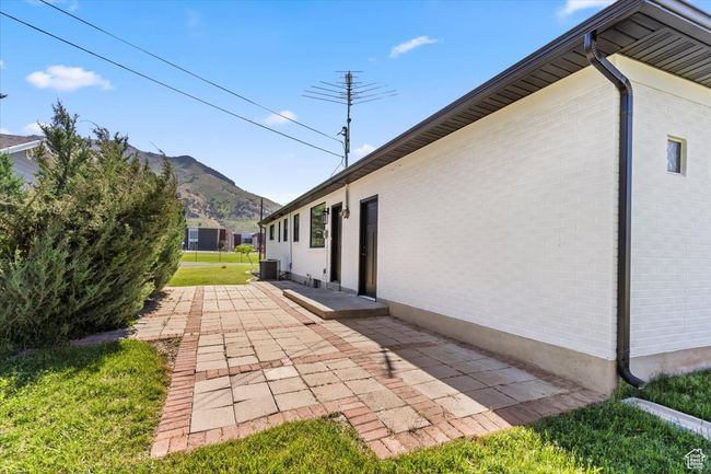 View of yard with a patio area and a mountain view | Image 34