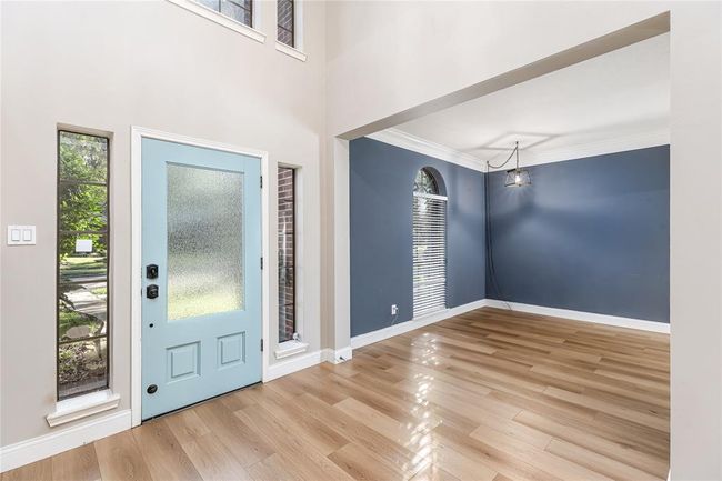 Foyer area with high ceilings and a flex space at the front of the home that could be used to work from home. | Image 6