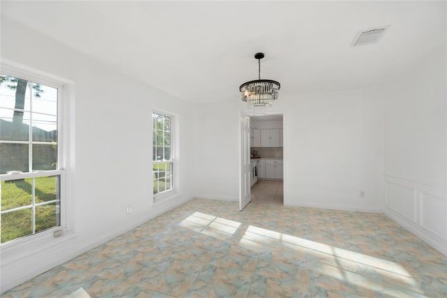 Very large formal dining with a beautiful new chandelier | Image 8