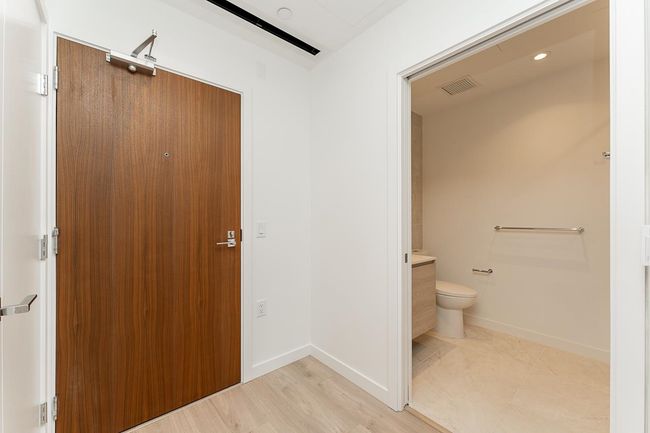 Bathroom featuring visible vents, toilet, vanity, and baseboards | Image 21