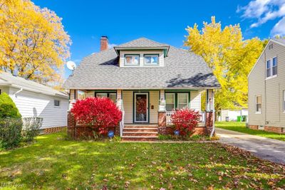 View of front of home featuring a porch and a front lawn | Image 1