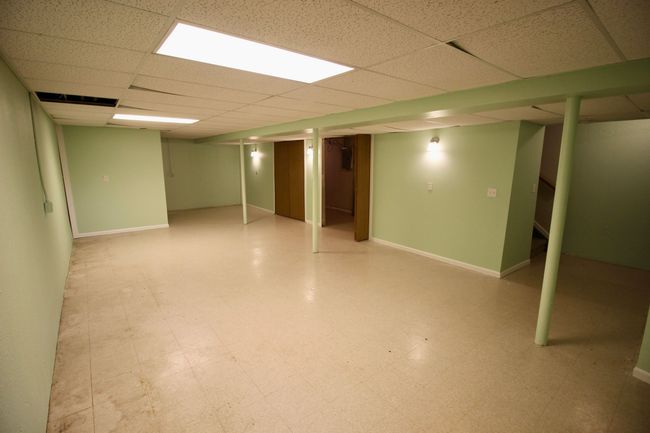 Freshly painted basement includes lavatory. | Image 24