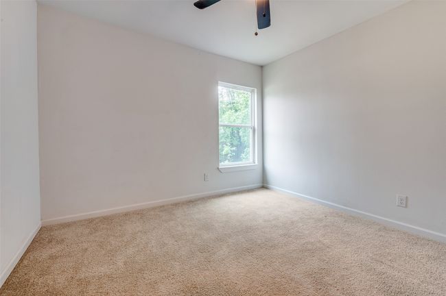 Spare room with carpet floors, a ceiling fan, and baseboards | Image 19