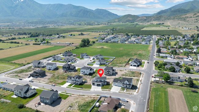 Aerial overview of property's location featuring a mountain backdrop, rural landscape, and nearby suburban area | Image 37