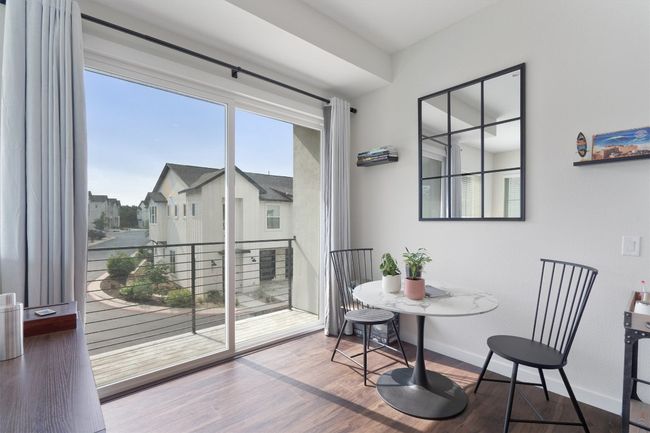 Dining room with wood finished floors and baseboards | Image 26