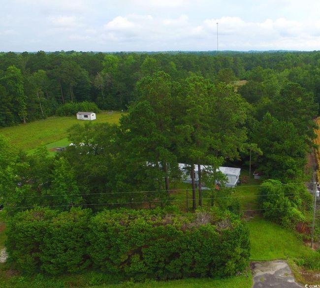 Aerial view of a heavily wooded area | Image 4