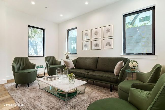Living room with wood finished floors, recessed lighting, and baseboards | Image 10