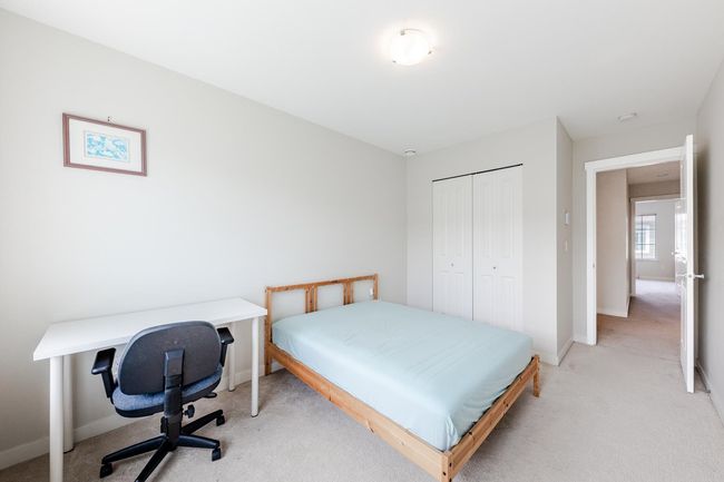Bedroom featuring light colored carpet and a closet | Image 24