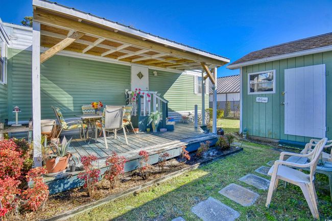 Rear view of house featuring a wooden deck | Image 12