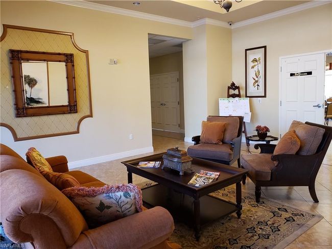Clubhouse lobby featuring crown molding, baseboards, and light tile patterned floors | Image 41