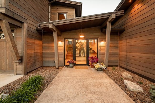 Architectural details flank the inviting front entry. | Image 12