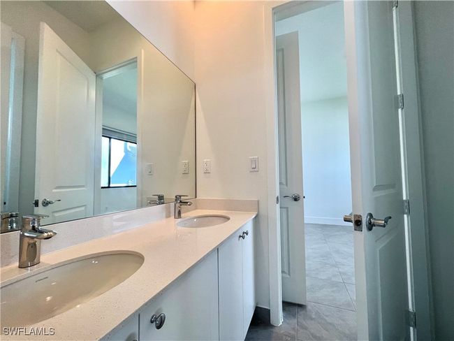 Bathroom featuring tile patterned floors and vanity | Image 26
