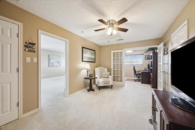 This versatile room offers endless possibilities—ideal as a bedroom, TV lounge, craft space, or your perfect retreat. | Image 12