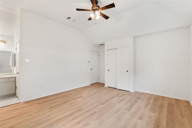 Dual closets and open entry to the bathroom give the primary suite a practical, roomy layout. | Image 14