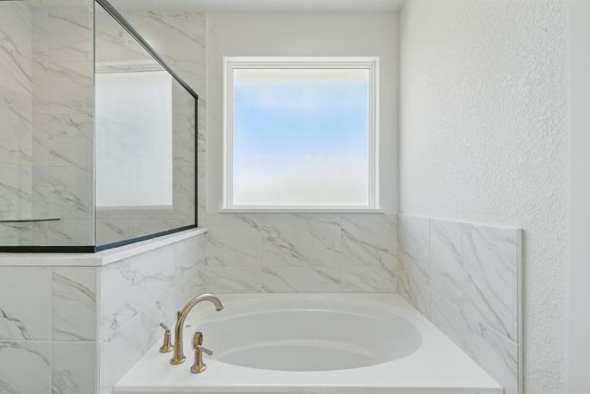 Bathroom with a garden tub and a textured wall | Image 14