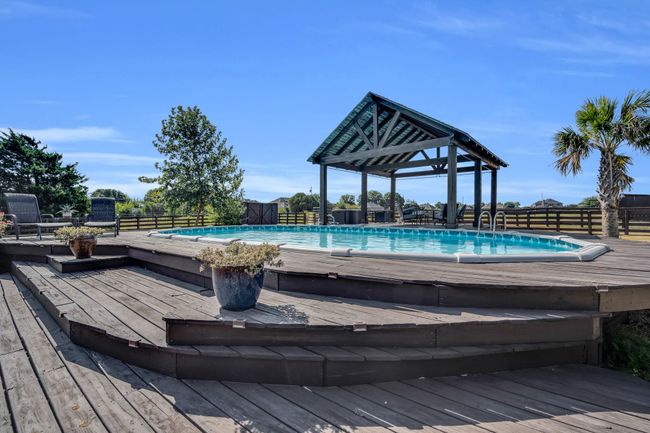 View of pool featuring a deck | Image 33