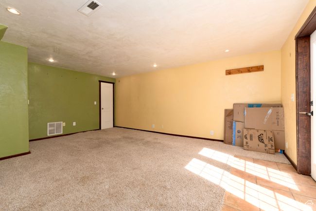 Carpeted empty room with recessed lighting and baseboards | Image 28