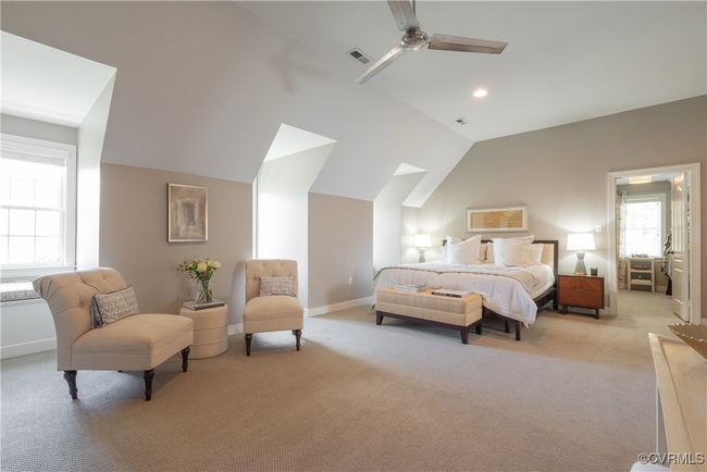 Bedroom with light carpet, vaulted ceiling, and visible vents | Image 31