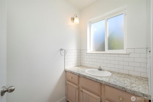 Main floor 3/4 bath, shower and toilet behind door | Image 13