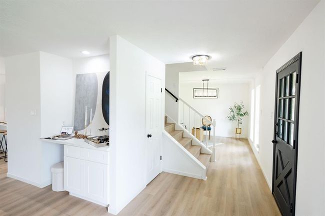 The entire home features updated light fixtures, fresh interior paint, and modern smart vinyl flooring throughout | Image 10