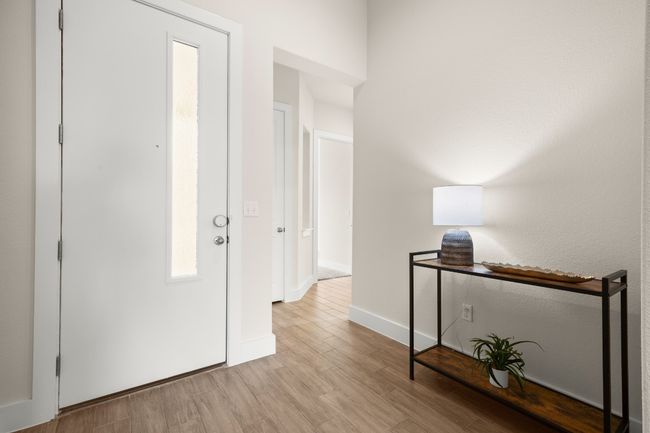 Hall featuring light wood-style floors and baseboards | Image 5