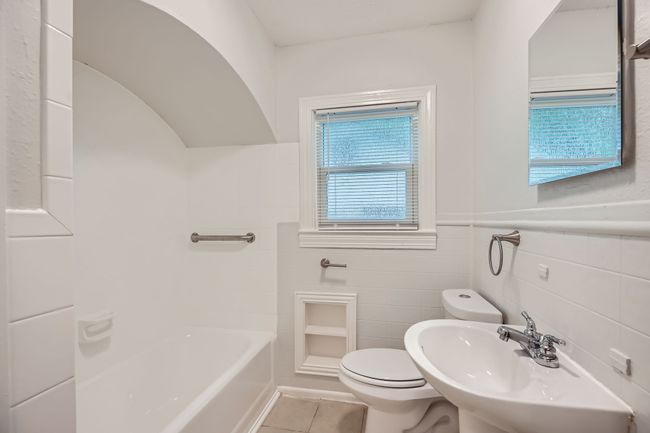 Full bathroom with walk in shower, tile patterned flooring, a tub to relax in, toilet, and a sink | Image 19